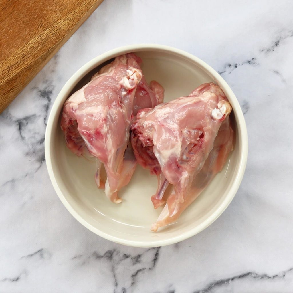 Chicken carcass' in a dog bowl
