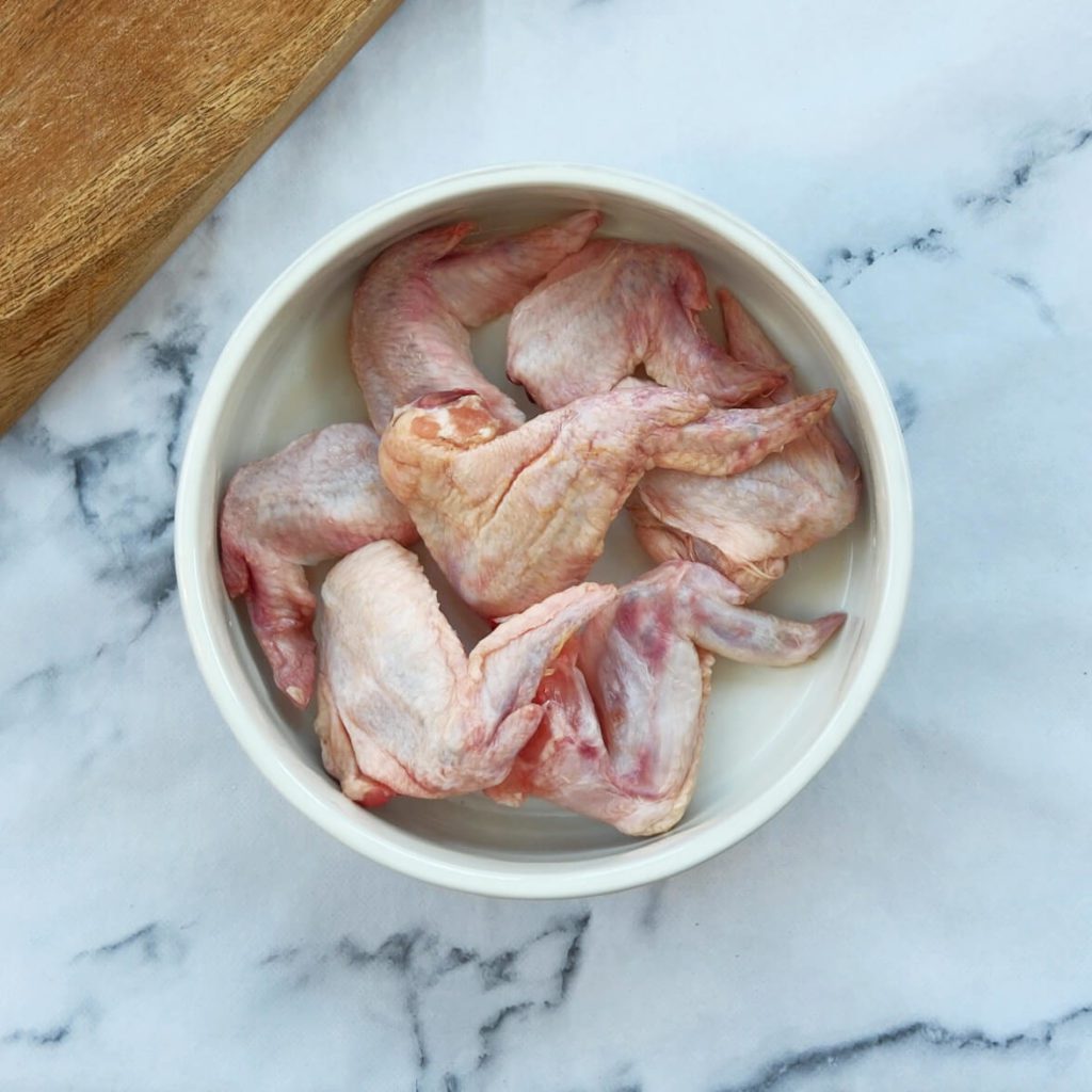 Chicken wings in a dog bowl