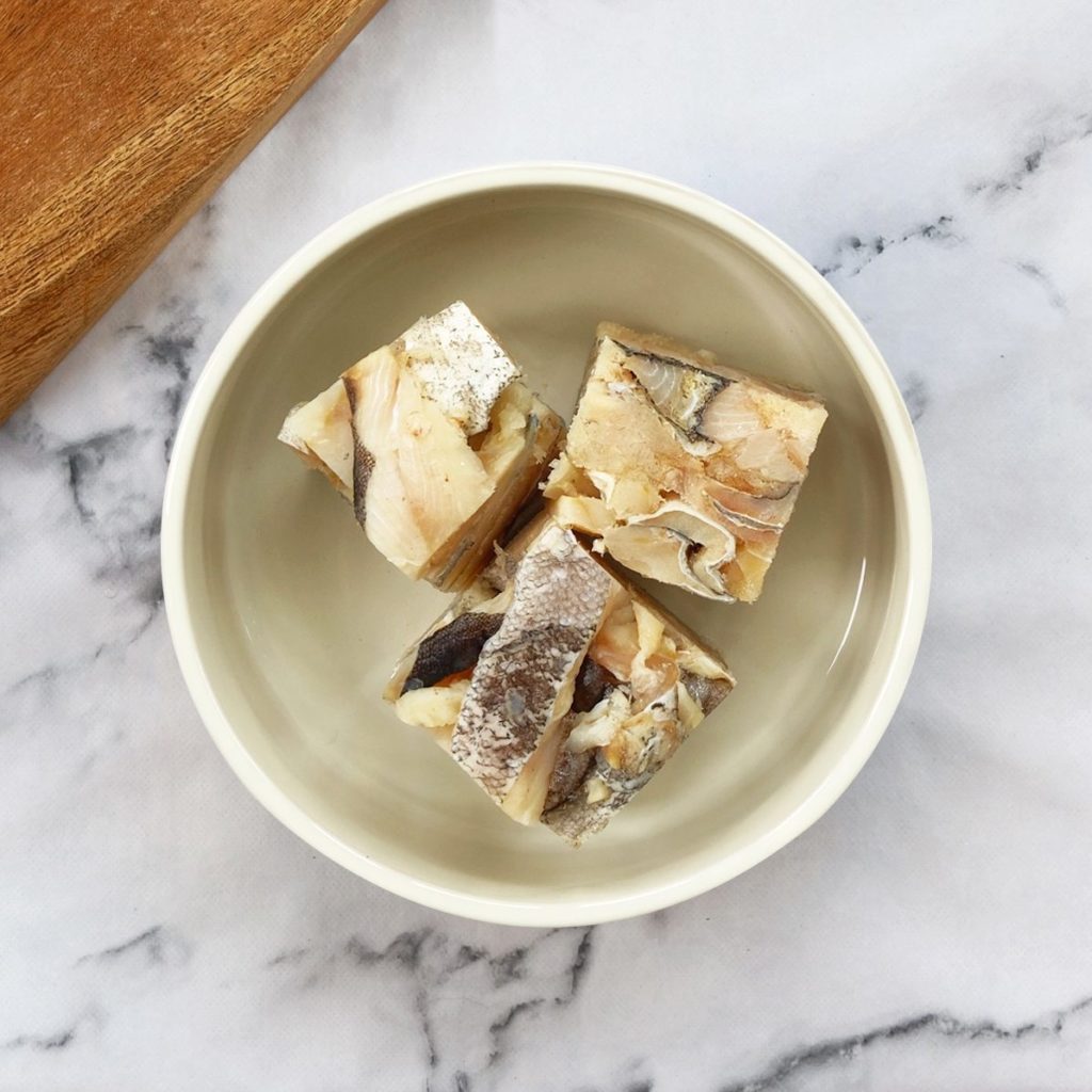 Cod chunks in a dog bowl
