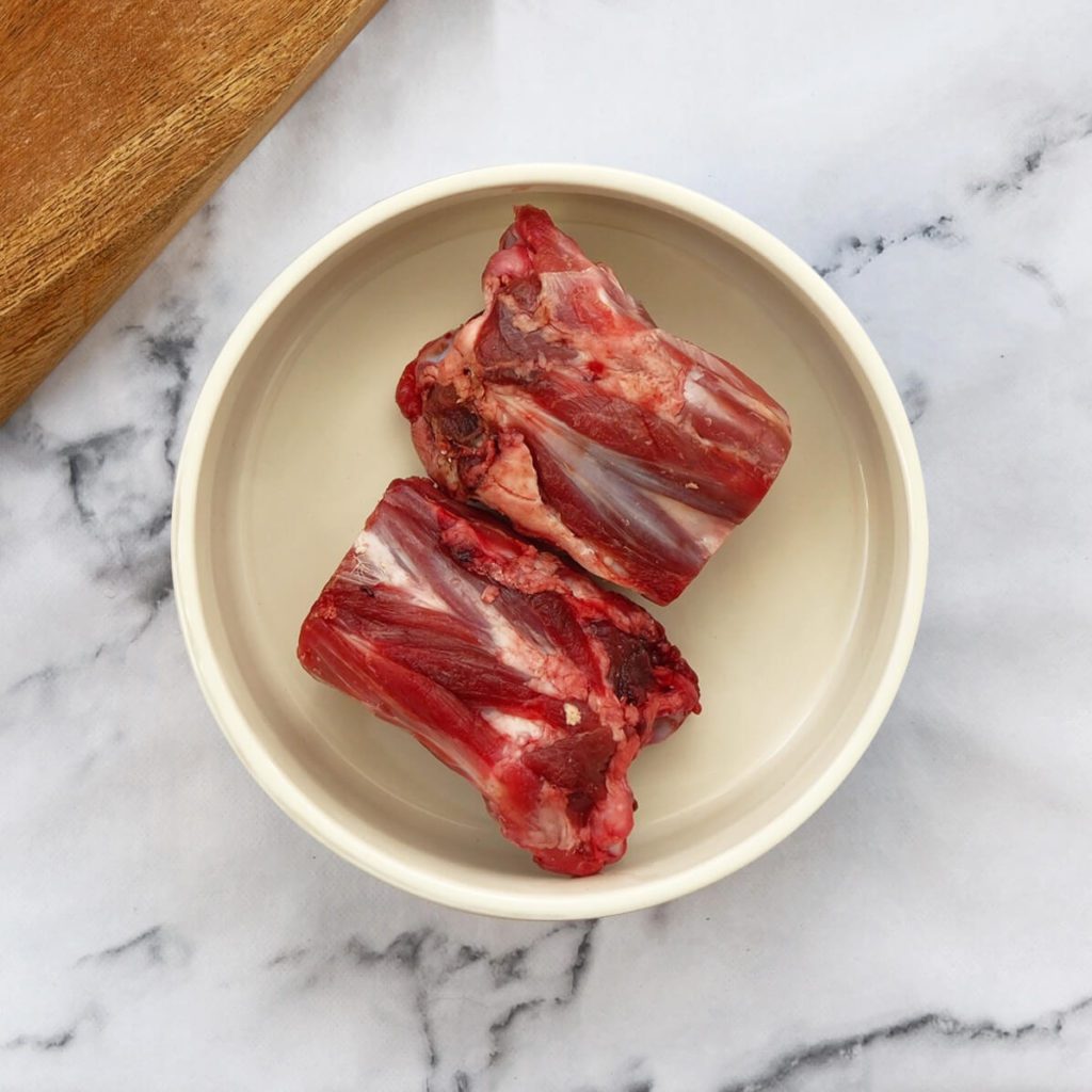 Lamb necks in a dog bowl