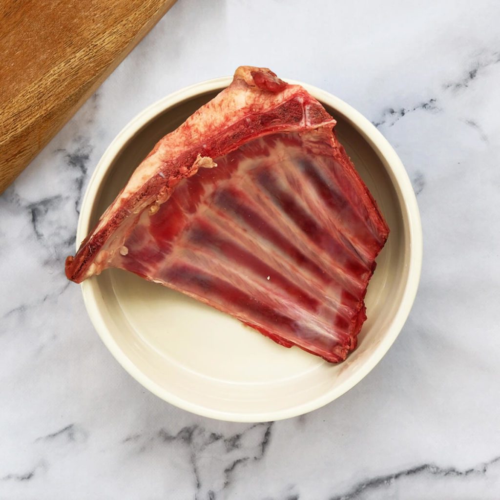 Lamb rib in a dog bowl