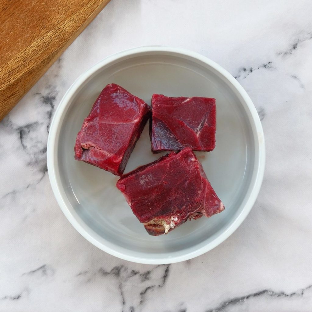 Lamb spleen in a dog bowl