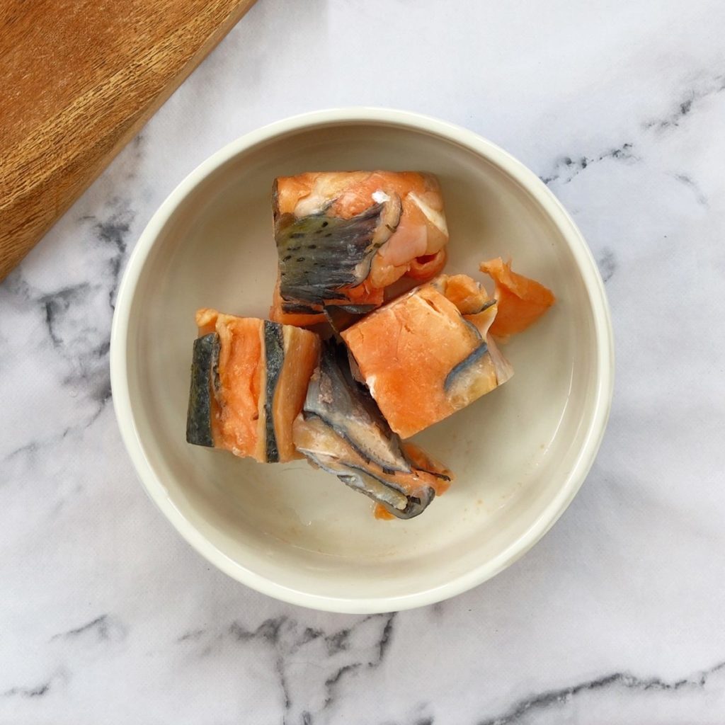 Salmon chunks in a dog bowl