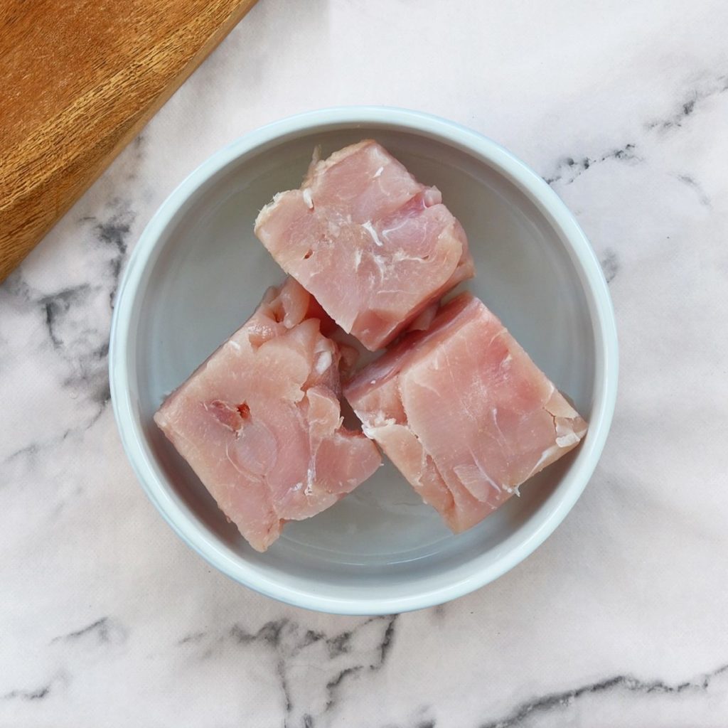 Turkey chunks in a dog bowl