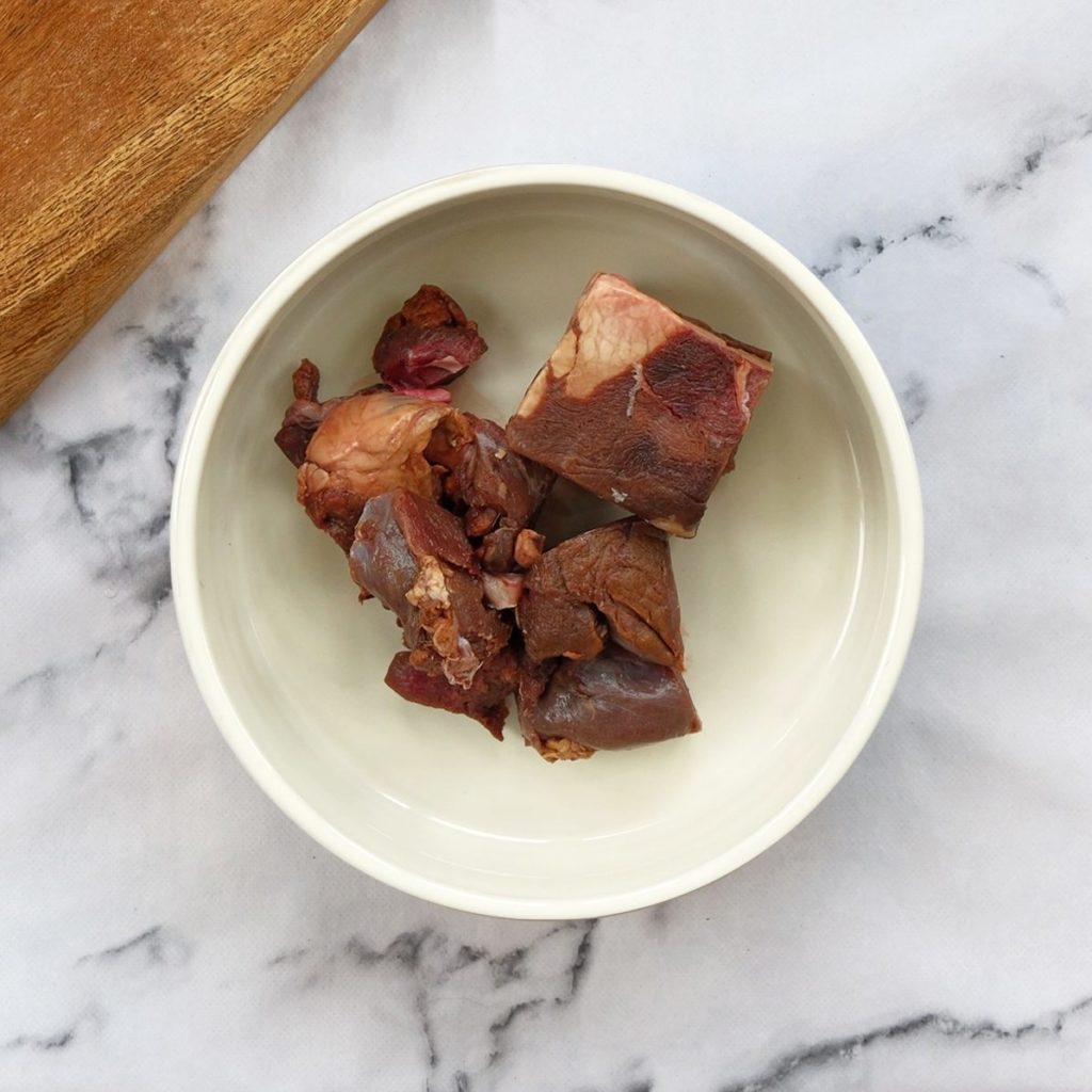 Venison chunks in a dog bowl