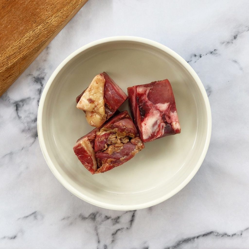 Wild boar chunks in a dog bowl