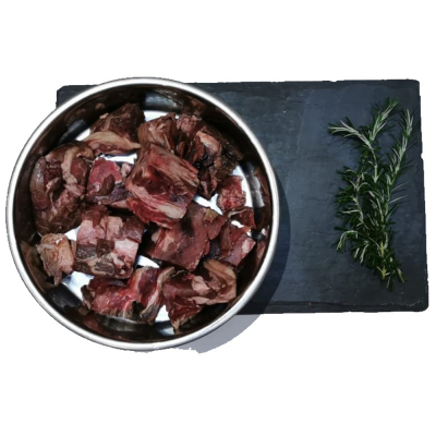 Beef Chunks Dog bowl on a slate placemat filled with beef chunks