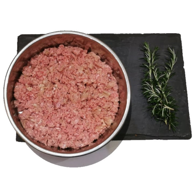 Beef Mince Dog food bowl filled with raw beef mince on a slate placemat